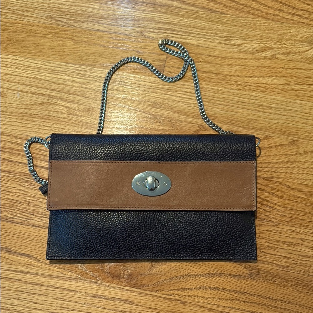 Cleo and Patek leather envelope bag